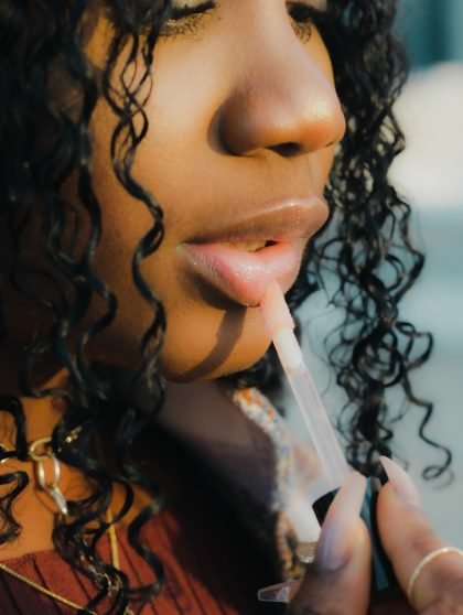 a close up of a person holding a toothbrush